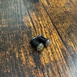 Black Plugs with Gold Accents